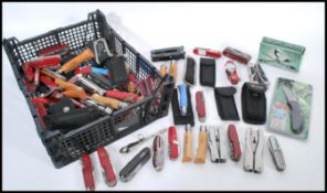 A large collection of various pen knives, Swiss army knives, multi tools etc some in pouches.