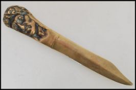 A 19th century bronze letter opener / paper knife dagger having a handle formed as Julius Caesar.