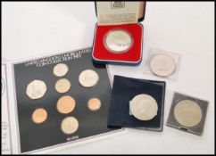 A collection of coins to include silver proof. The coins consisting of a United Kingdom Uncirculated