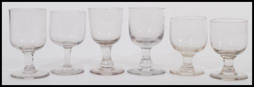 An assortment of 19th Century rummer glasses having bucket bowls, with short columns some having