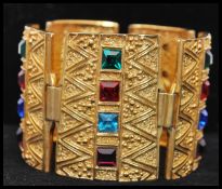 A vintage signed Sphinx Egyptian revival gold-tone bracelet set with square cut coloured glass