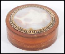 A vintage 20th century amber lucite trinket / powder pot of cylindrical form having a shell inlaid