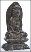 A 20th century Chinese figurine of a Buddha raised on pedestal base modelled in the lotus position