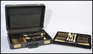 A vintage Solingen of W Germany 23-24 carat gold-plated canteen of cutlery for twelve settings