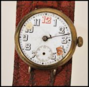 A vintage early 20th century WW1 officers trench watch set to an oversized leather strap. The