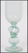 A very large early 19th century Georgian tall wine glass boblet raised on a spread circular foot