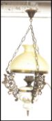 An early 20th Century electric Continental brass and ceramic rise and fall ceiling chandelier with