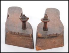 A pair of 19th century Chinese carved wooden shoes / clogs raised on large heel with turned wooden