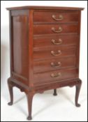 An early 20th Century Edwardian mahogany six drawer music cabinet, fall front drawers fitted with