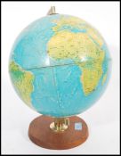 A vintage retro 20th century 1960's Philips desktop terrestrial globe raised on circular wooden base