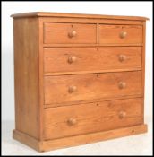 A Victorian pine country 2 over 3 chest of drawers. Raised on a plinth base with short and deep