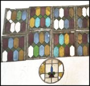 A collection of 19th Century Art Nouveau leaded stained glass window panels, nine in total, eight