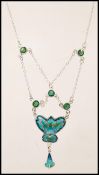 A stamped sterling silver necklace in the Art Nouveau style having blue and green enamelled panels