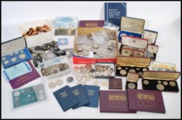 A collection of antique and later coins to include various pre 1947 silver Georgian Victorian and