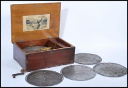 A 19th century walnut and stencil decorated table top polyphon box, possibly Swiss being complete