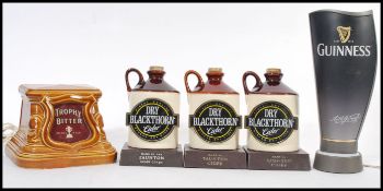 A group of vintage retro 20th century pub breweriana ceramic stoneware lamps with notation for