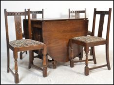 A Jaycee / Old Charm style oak drop leaf dining table together with a set of 4 dining chairs.