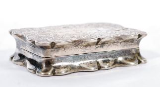 A 19th century Victorian hallmarked silver lidded snuff box having a scalloped edge with engraved