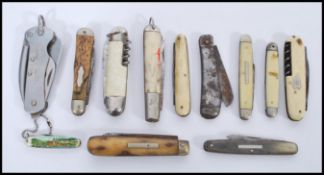 A collection of vintage early 20th century pen knives to include military issue examples. 11cm