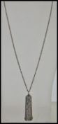 An early 20th Century Victorian silver pendant necklace with a cheroot holder case pendant with