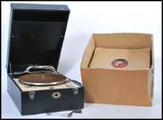 A vintage 20th century portable record player gramophone by Deca model 50 having hinged lid with