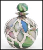 A silver and glass perfume bottle of bulbous form complete with stopper. Silver stamped 800