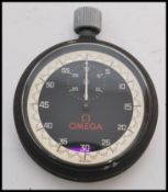 A vintage 20th century Omega stopwatch timer clock of pocket watch shape complete in original box.