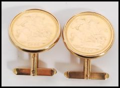 A pair of half sovereign gold coin cufflinks by the Royal Mint set to 9ct gold cuffs complete in