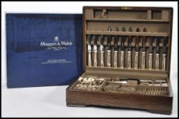 A wooden cased cutlery canteen by Mappin and Webb in original box, canteen having stamped mappin