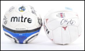 A signed Bristol Rovers F.C. football including signatures from Scott McGleisch and Matt Gill, along