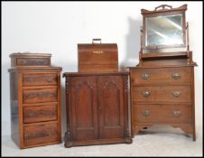 A 19th century Arts & Crafts oak dressing chest of drawers having good swing mirror over bank of