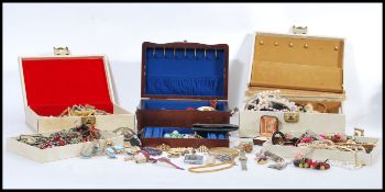 A selection of vintage costume jewellery to include simulation pearls, a stratton compact, clip on