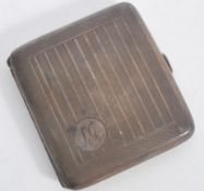An early 20th century silver hallmarked cigarette case of square form with engine turned decoration.