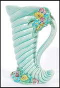 A Clarice Cliff My Garden pattern Cornucopia vase shape number 809. Cornucopia designed resting on a