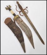 A 19th century Kukri knife in sheaf with bone decorated handle along with an antique dagger with