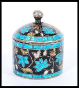 A vintage 20th century silver cloisonne trinket / pill pot of cylindrical form with ball finial lid.