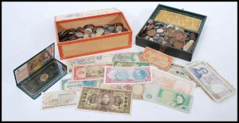 A collection of vintage and antique coins and notes dating from the 19th Century. Coins and notes