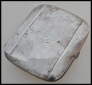 A vintage silver cigarette case of rectangular form having monogrammed SG. Stamped 800. Weighs 88