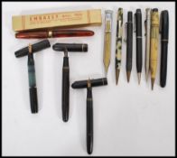 A collection of vintage fountain and other pens to include a Waterman 14ct gold nib, Swan 14ct