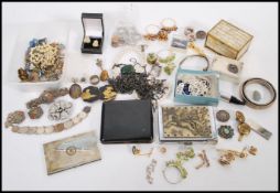 A collection of silver and vintage costume jewellery to include earrings, brooches, rings, coin