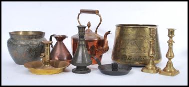 A collection of brass and copper items to include an Egyptian planter decorated with traditional
