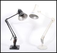 Two vintage retro 20th century industrial desk lamps comprising of a white Herbert Terry