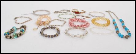 A collection of vintage silver and other bangles and bracelets to include hallmarked examples,