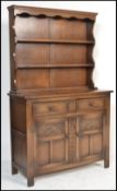 A 20th century Jacobean revival oak dresser in the manner of Jaycee / Old Charm. Cupboards with