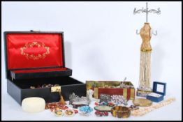 A good selection of vintage costume jewellery to include simulation pearls, a stratton compact, clip