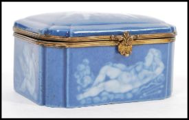 An early 20th Century continental German porcelain blue ceramic casket / trinket box with a pat