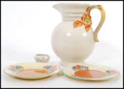 A Clarice Cliff My Garden pattern jug along with a pair of Crocus pattern plates and small Clarice