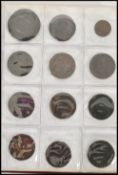 A collection of tokens dating from the 18th - 20th century. British and world approx 87 in folder.