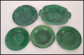 A group of five 19th century Wedgwood majolica plates and tray all having majolica leaf