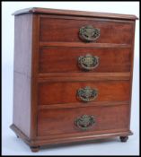 A Victorian 19th century table top specimen chest. Raised on bun feet with an upright pedestal /